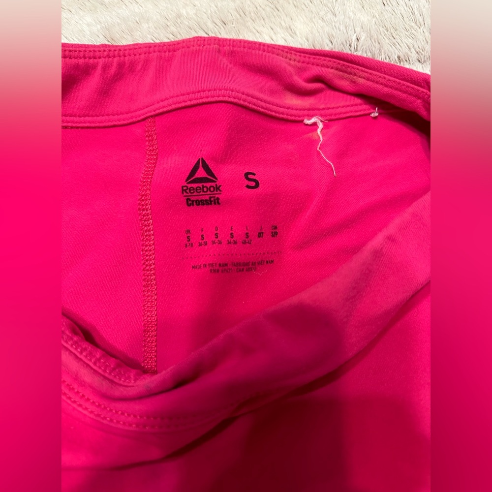 4 pairs of athletic shorts- Reebok and Fleo. Size med and small